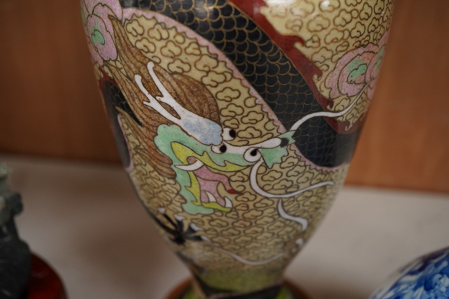 A Japanese Imari dish an Arita bottle vase together with a Chinese cloisonné enamel vase and a Chinese hardstone boulder carving, largest 34cm in diameter